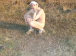 guy sitting nude on the farm
