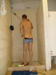 Pulling down his swim boxer