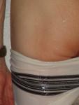 Pulling down the white square leg brief, close up (rear)