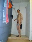 Pulling his penis out from the white swim brief