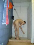 Side view while bending over in the shower for the soap