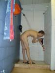 Reaching for soap, water hitting his back