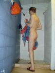 Drying off in the swim locker room shower