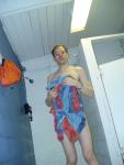 Drying off in the swim locker room shower