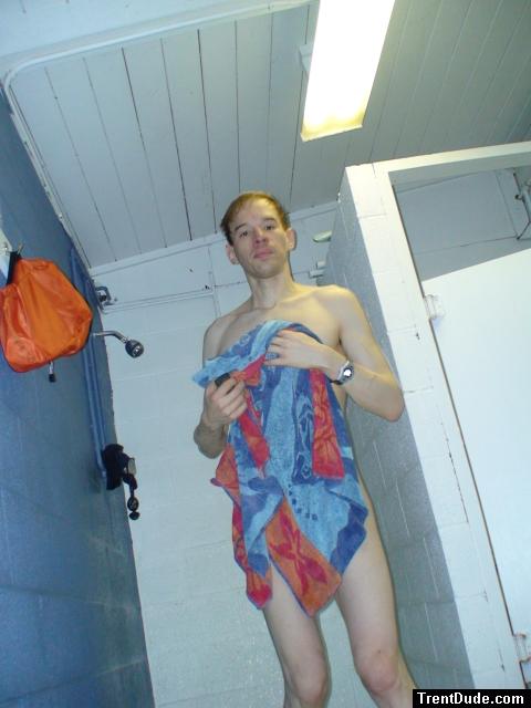 Drying off in the swim locker room shower