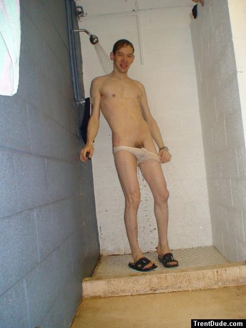 pulling down his white swim brief, pubic hair