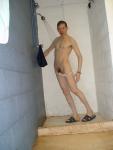 pulling down white swim brief, pubic hair