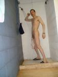 swim brief hanging from the the glans of his circumcised penis