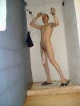 swim brief hanging from the the glans of his circumcised penis (armpits)