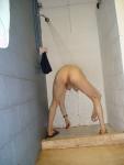 Bending over in the shower with some soap