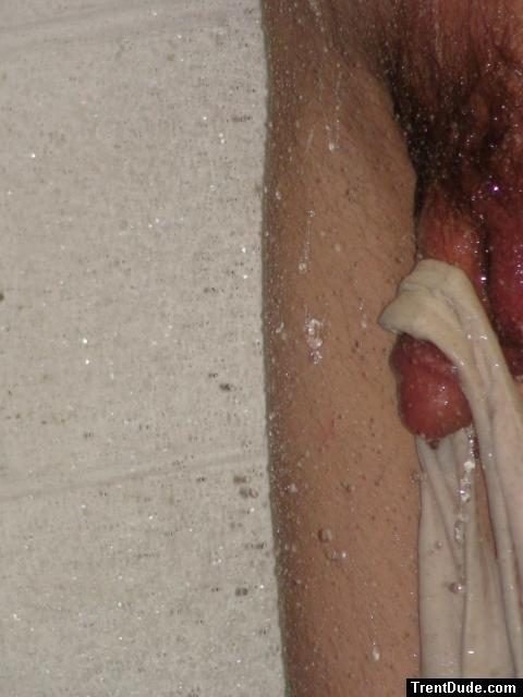 Closeup of swim brief hanging from penis