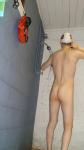 Showering in a white swim cap