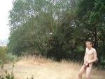 (distance is too far) Outdoors - Brickyard -  Nude putting on Red Hanes